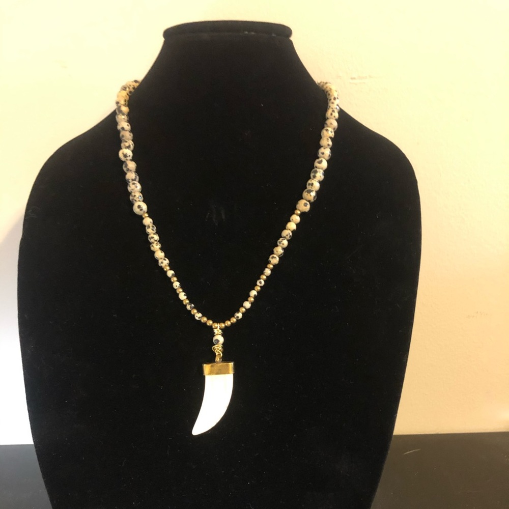Carved horn pendant with Dalmatian jasper beads.